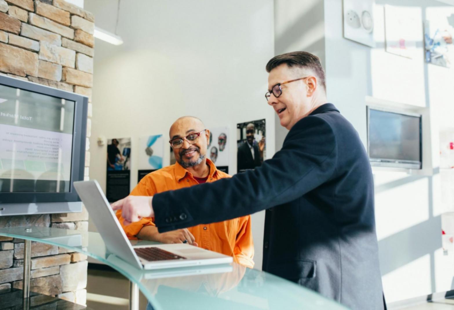 Students collaborating on SEO analytics project with data visualisations and research materials